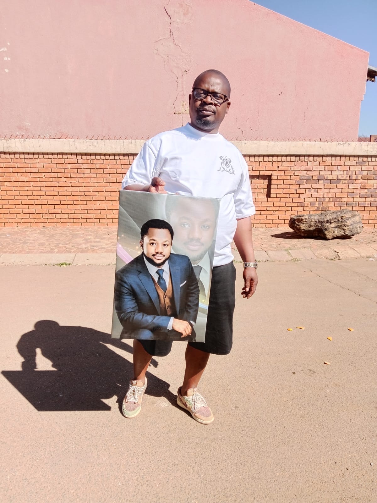 Portrait canvas held by owner