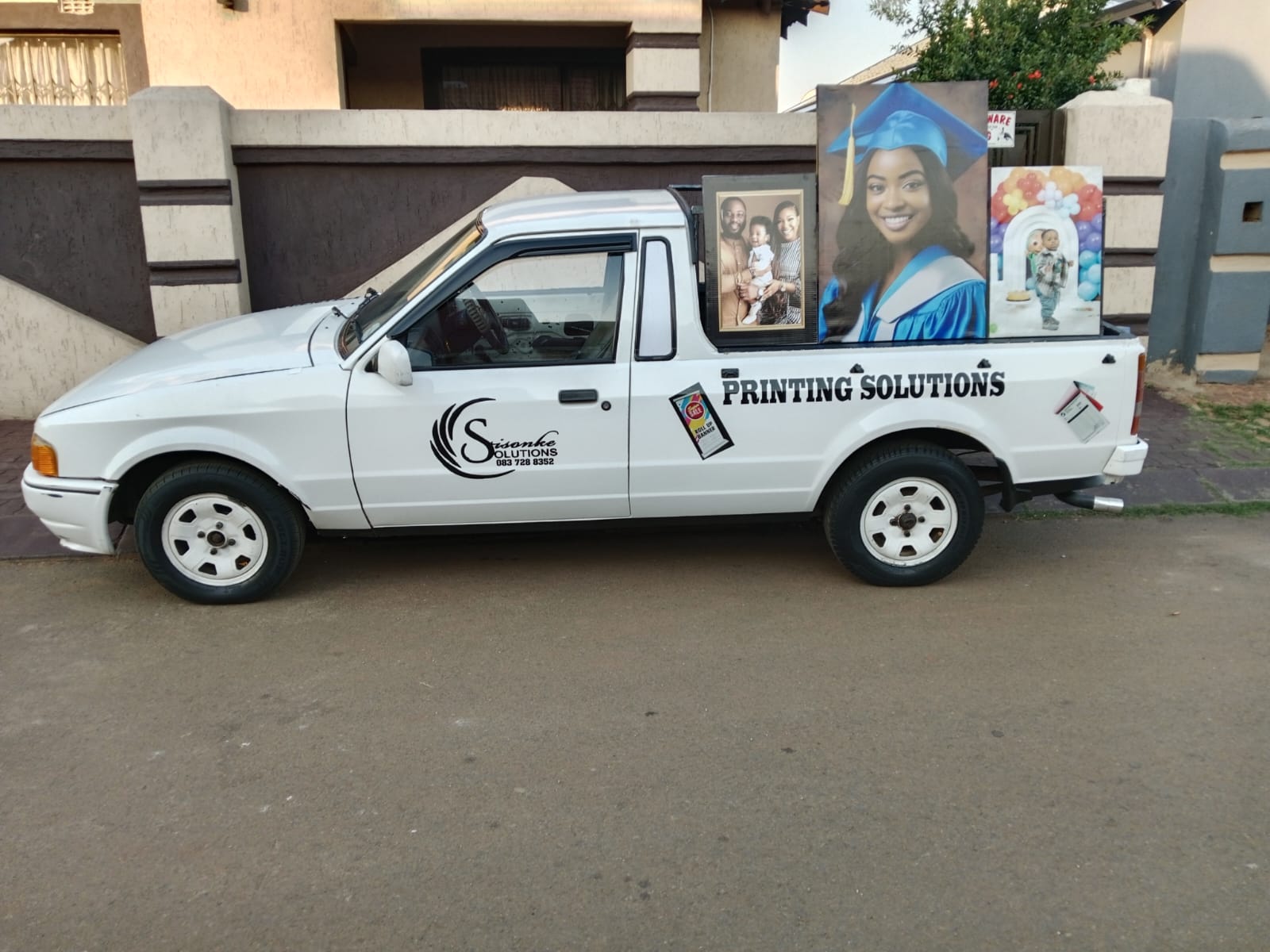 Sisonke Solutions branded delivery bakkie loaded with canvas prints